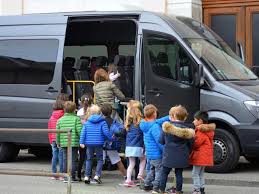 Children Getting Onto Minibus
